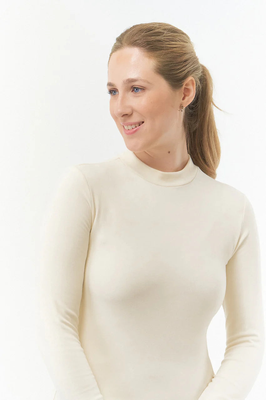 PURE GOLF  OLWEN MOCK NECK TOP CHAMPAGNE